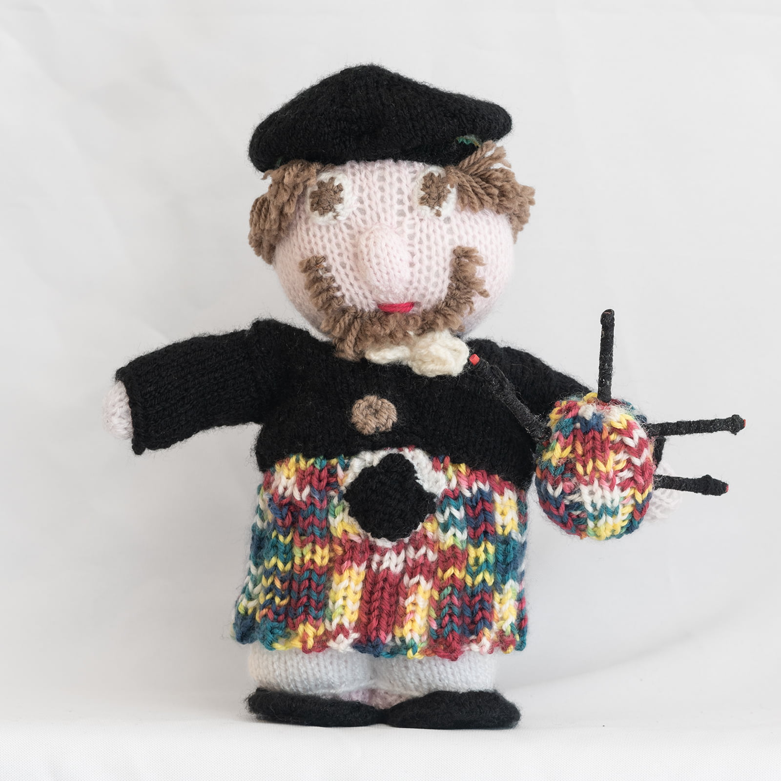 Hand knitted Scottish piper