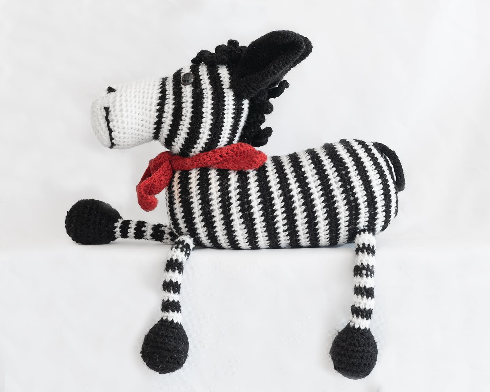 hand knitted zebra with scarf