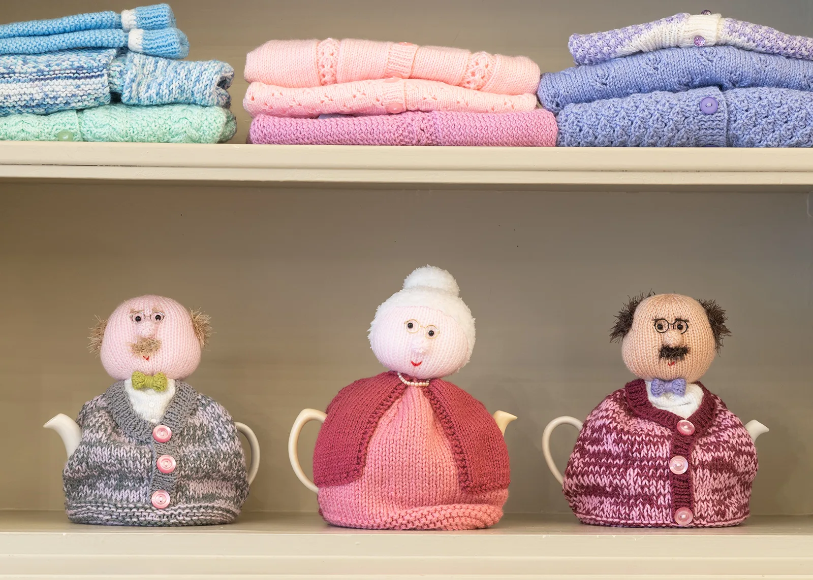 hand knitted grandpa grandma tea cosy