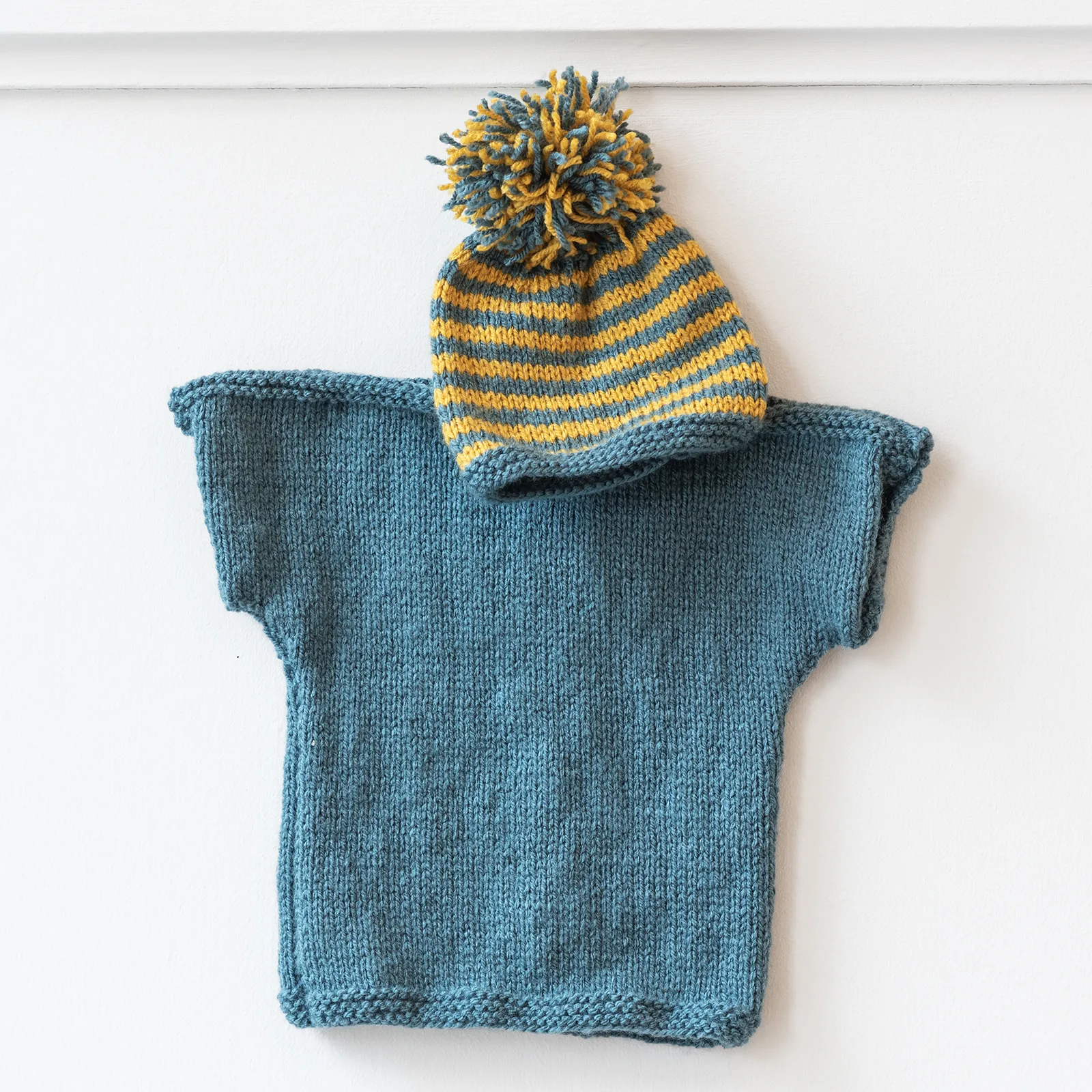 hand knitted blue yellow jumper and hat